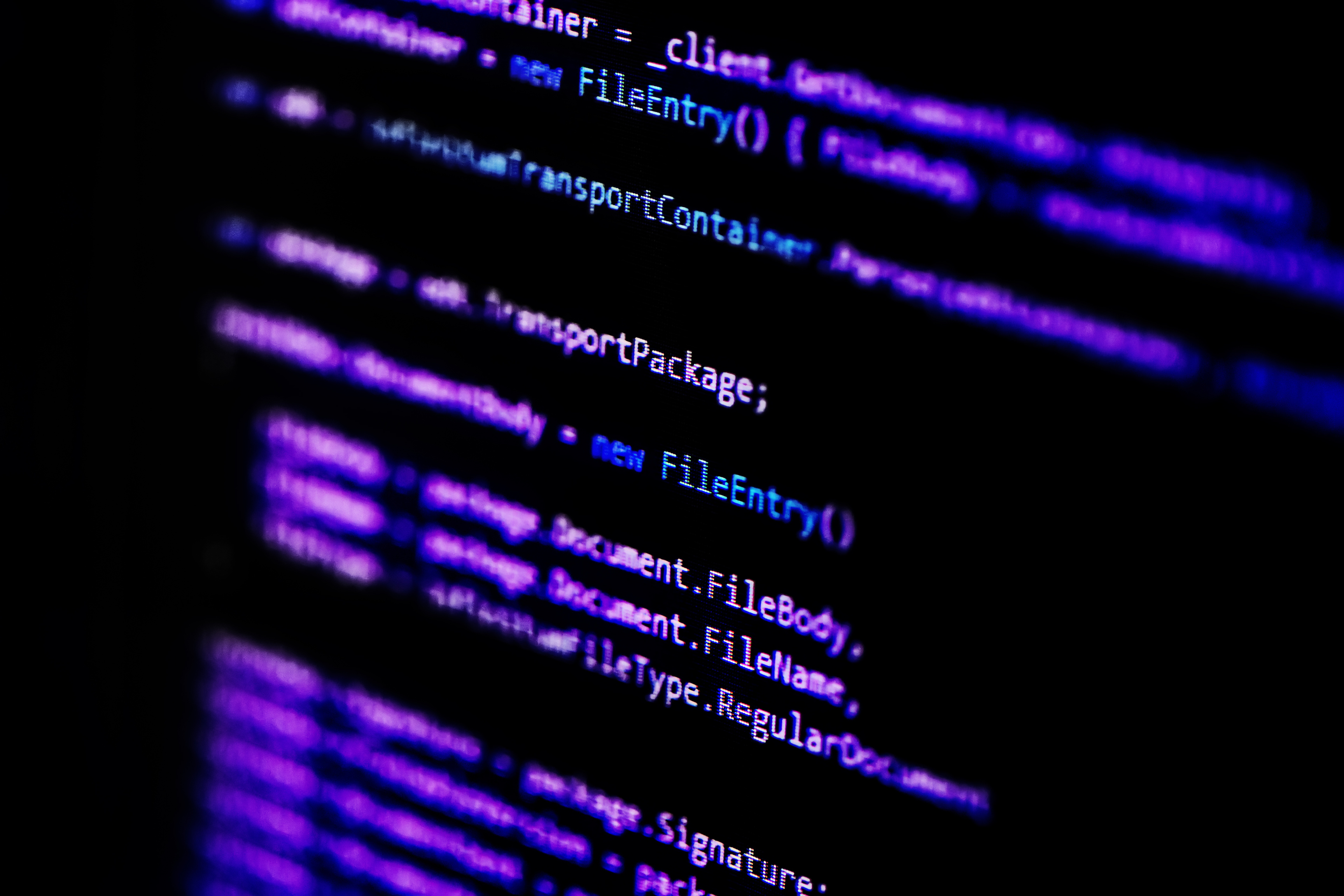 Information technology concept. Coding programmer language script text on screen monitor display. Programmer occupation job. Selective focus